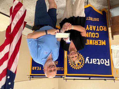 Meriwether Co Rotary Club Vice President Susan Zeigler presents Bob Patterson a donation for the DORCAS Food Panry ministery.jpg